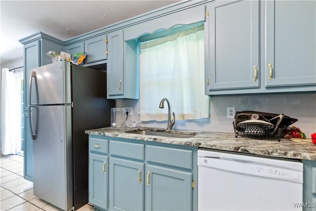 7665 Baptist Campground Rd, Northport, AL 35473 - kitchen featuring blue cabinets, white dishwasher, and a sink