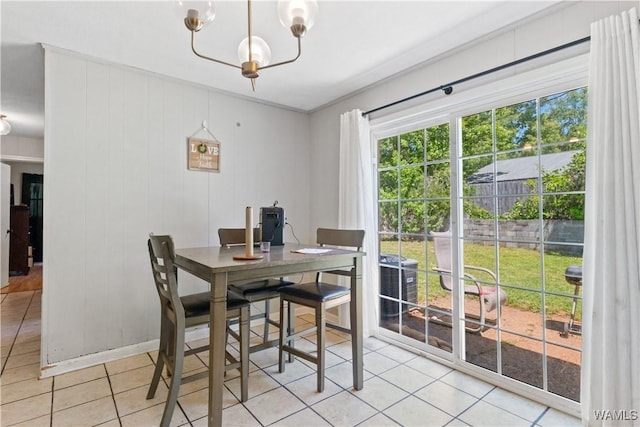 7665 Baptist Campground Rd, Northport, AL 35473 - dining area with baseboards, light tile patterned flooring, and an inviting chandelier