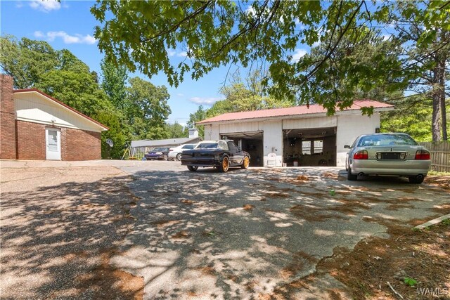 7665 Baptist Campground Rd, Northport, AL 35473 - view of side of home with fence and aphalt driveway