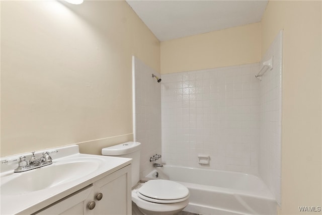 full bathroom featuring vanity, toilet, and tiled shower / bath