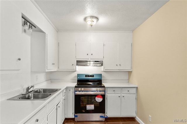 kitchen with a textured ceiling, white cabinets, stainless steel range oven, and sink