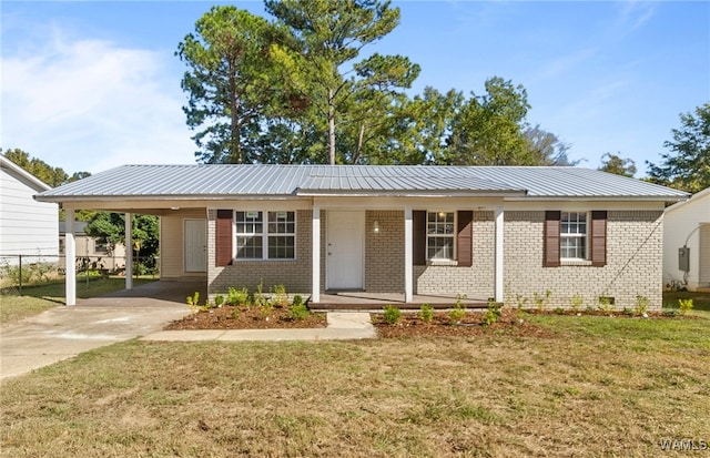 single story home featuring a front yard, a carport, and covered porch