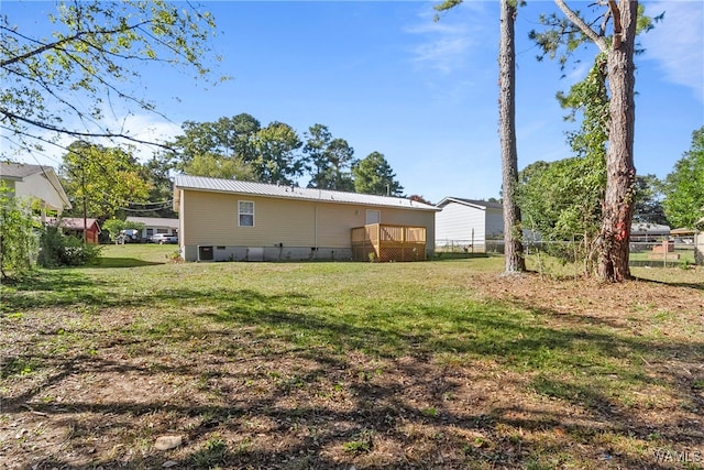 back of property featuring a yard