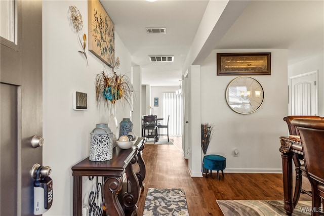 hallway featuring dark hardwood / wood-style flooring