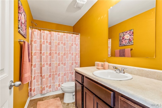 full bathroom featuring tile patterned flooring, shower / bath combination with curtain, vanity, and toilet