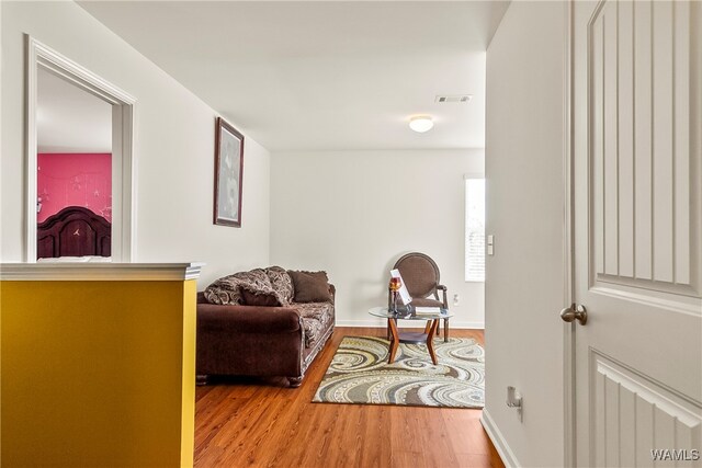 living area with hardwood / wood-style flooring