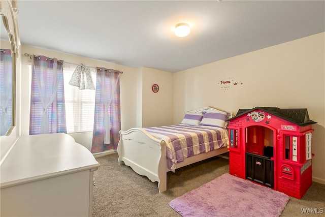 bedroom featuring dark colored carpet