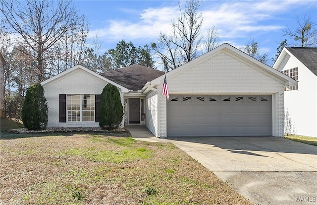 ranch-style home with a front lawn, concrete driveway, brick siding, and an attached garage