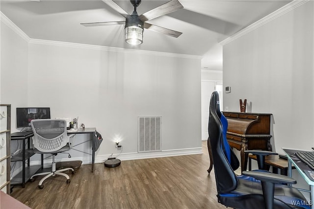 office space with baseboards, visible vents, ceiling fan, wood finished floors, and crown molding