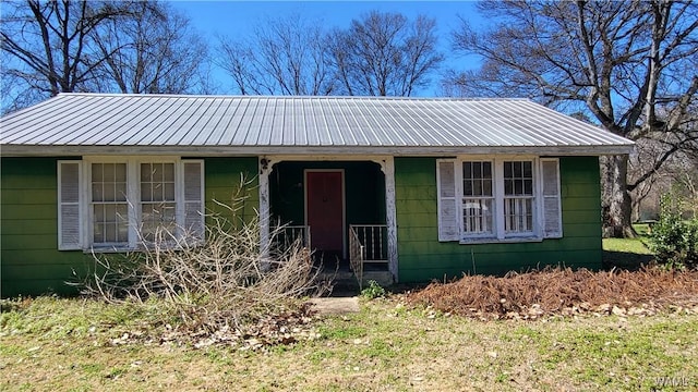 view of front of property featuring a porch and metal roof