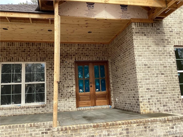 property entrance featuring french doors