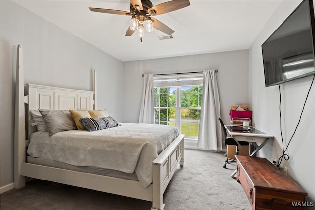 bedroom featuring light colored carpet, ceiling fan, and baseboards