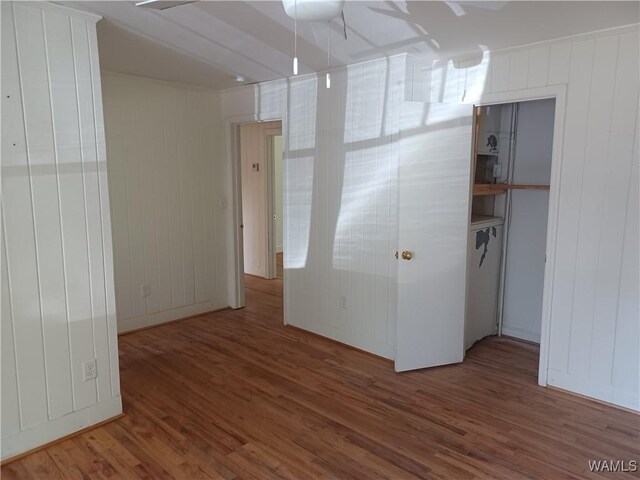spare room featuring wood finished floors