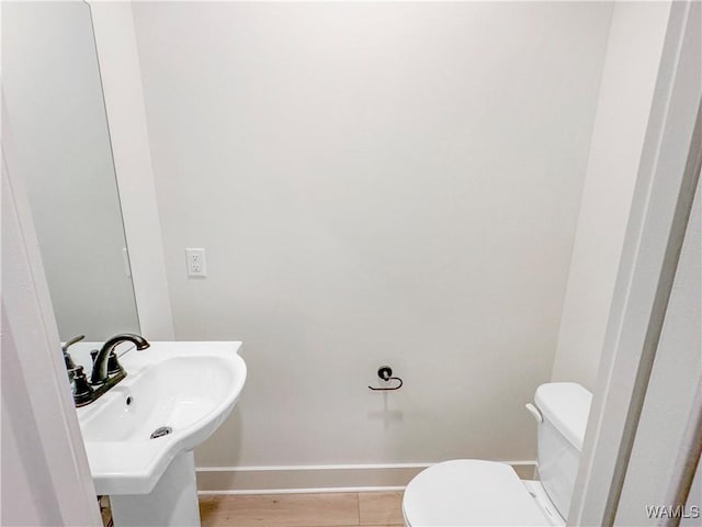 8 Northside Rd, Berry, AL 35546 - bathroom with baseboards, toilet, and a sink