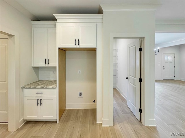 8 Northside Rd, Berry, AL 35546 - kitchen featuring light wood-style floors, white cabinets, baseboards, and tasteful backsplash