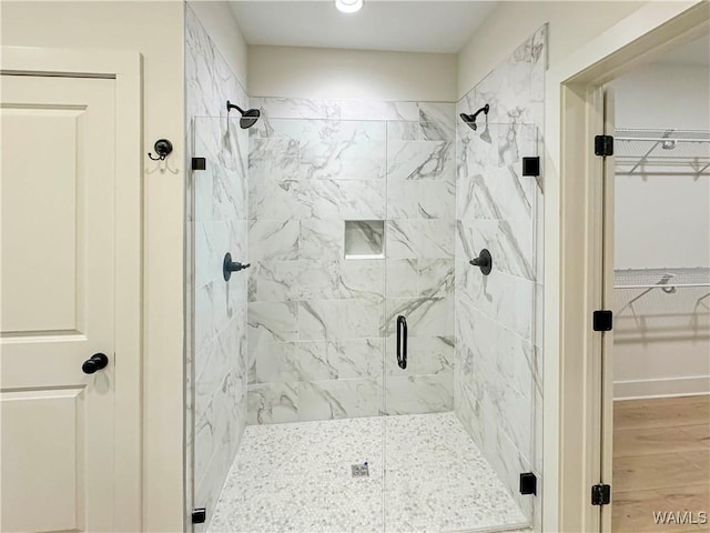 8 Northside Rd, Berry, AL 35546 - bathroom with a shower stall, a walk in closet, and wood finished floors