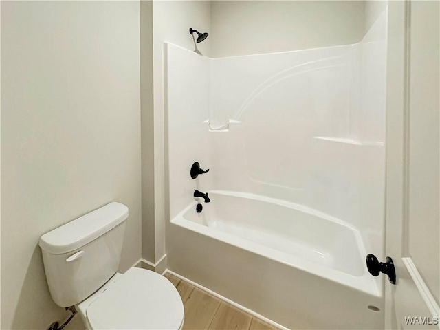 8 Northside Rd, Berry, AL 35546 - bathroom featuring toilet, shower / tub combination, wood finished floors, and baseboards