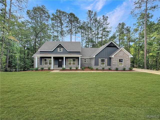 8 Northside Rd, Berry, AL 35546 - craftsman-style home with a front yard, a porch, board and batten siding, and brick siding