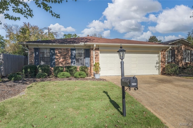 single story home featuring a garage and a front yard