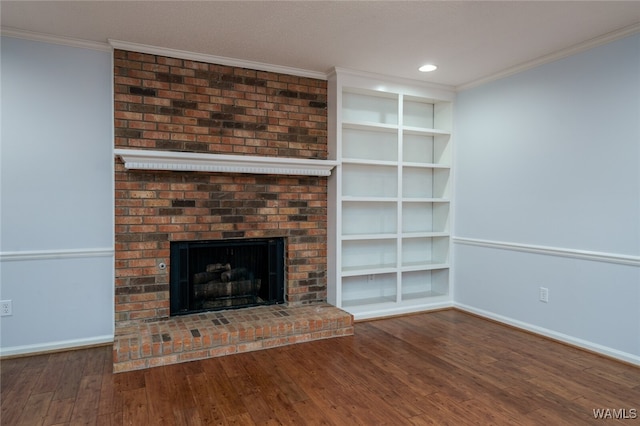 unfurnished living room with hardwood / wood-style floors, a fireplace, and crown molding