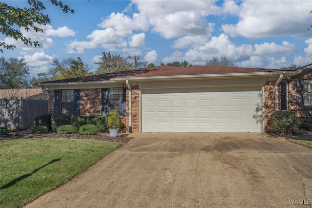 ranch-style home with a garage and a front yard