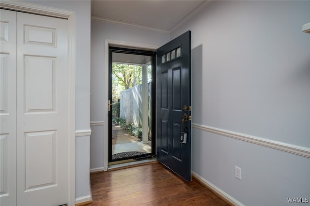 interior space featuring dark hardwood / wood-style flooring and ornamental molding