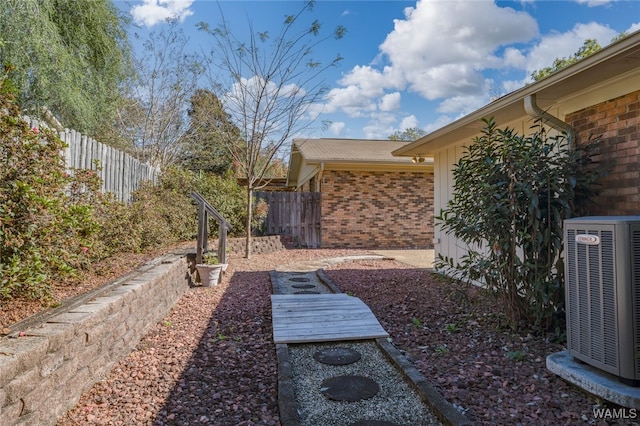 view of yard featuring central AC unit