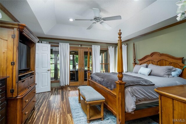 1428 Plymouth Ln, Tuscaloosa, AL 35406 - bedroom featuring a raised ceiling, french doors, dark wood finished floors, access to exterior, and recessed lighting