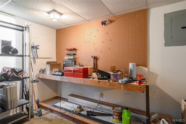 1428 Plymouth Ln, Tuscaloosa, AL 35406 - home office featuring a workshop area, electric panel, a drop ceiling, and unfinished concrete floors