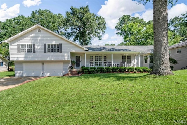 1428 Plymouth Ln, Tuscaloosa, AL 35406 - tri-level home with covered porch, a front lawn, a garage, and concrete driveway