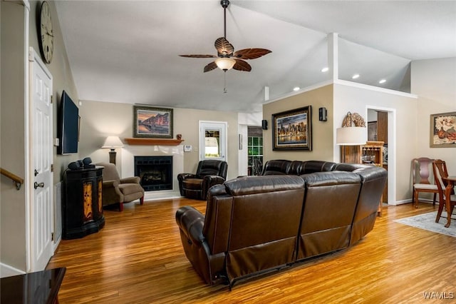1428 Plymouth Ln, Tuscaloosa, AL 35406 - living area featuring ceiling fan, light wood-type flooring, a fireplace with raised hearth, recessed lighting, and lofted ceiling