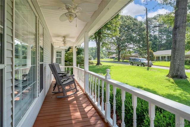 1428 Plymouth Ln, Tuscaloosa, AL 35406 - wooden porch featuring a ceiling fan and a yard