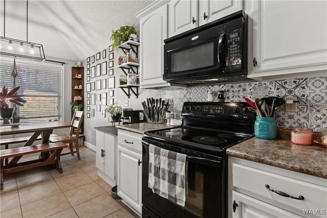 kitchen featuring black appliances, white cabinets, light tile patterned floors, a textured ceiling, and decorative light fixtures