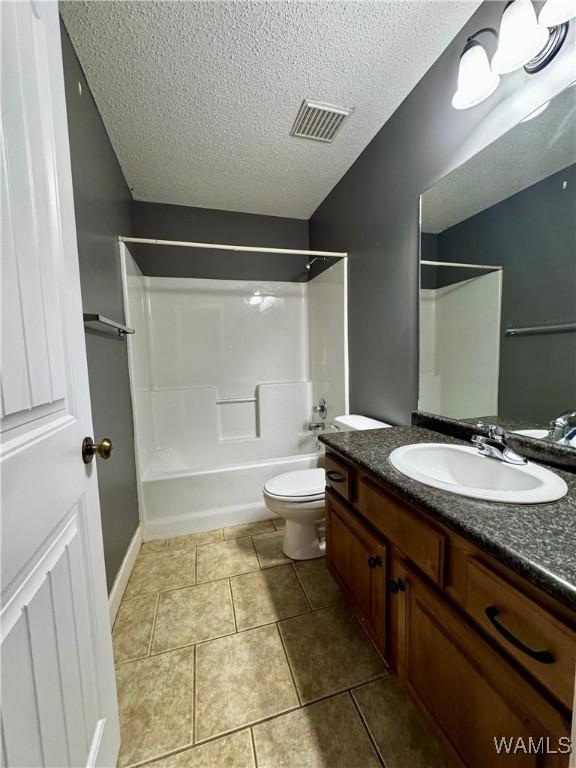 bathroom with vanity, separate shower and tub, and a textured ceiling