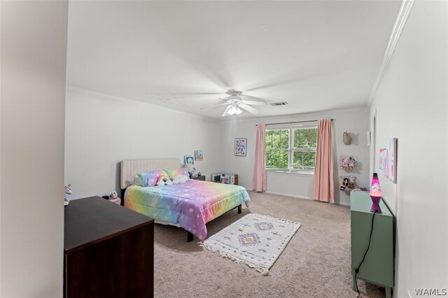 carpeted bedroom with ceiling fan and crown molding