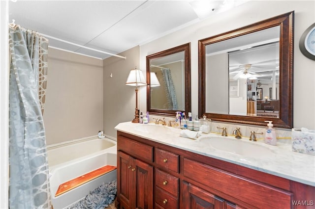 bathroom featuring double vanity, a sink, and a ceiling fan