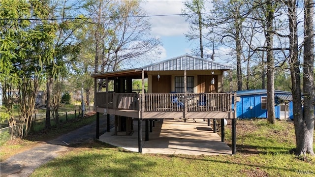 view of front of home featuring a deck and a patio area