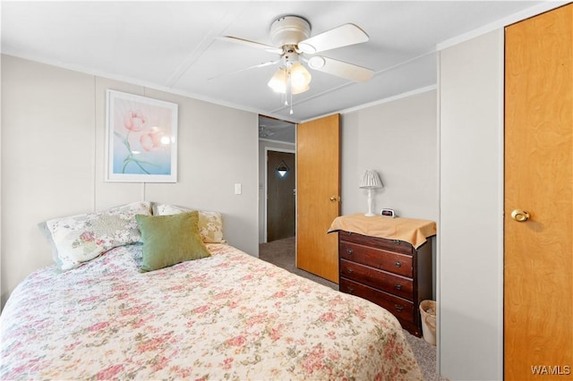 bedroom with crown molding, carpet, and ceiling fan