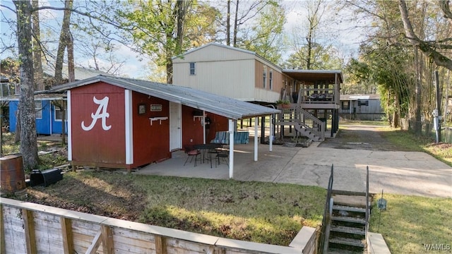 exterior space featuring stairway and a patio area