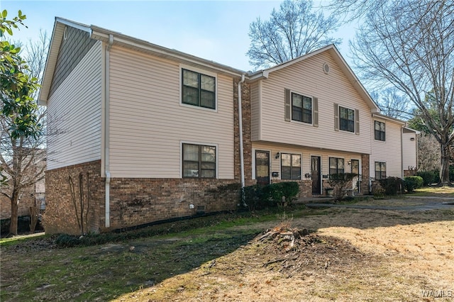 view of front facade featuring brick siding