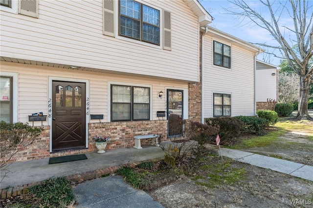 view of front of house with brick siding