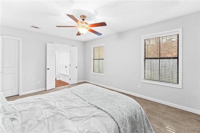 bedroom with carpet, visible vents, ceiling fan, and baseboards