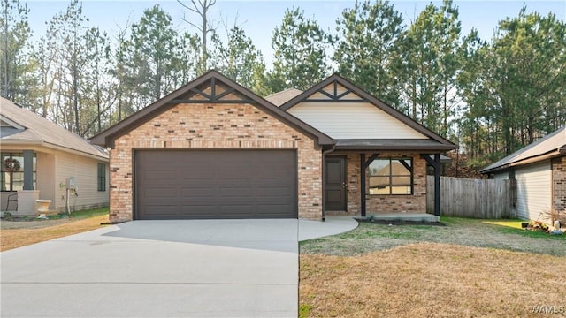 view of front facade featuring a garage, driveway, fence, a front lawn, and brick siding