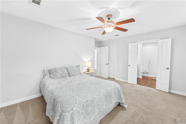 bedroom featuring carpet, visible vents, and baseboards