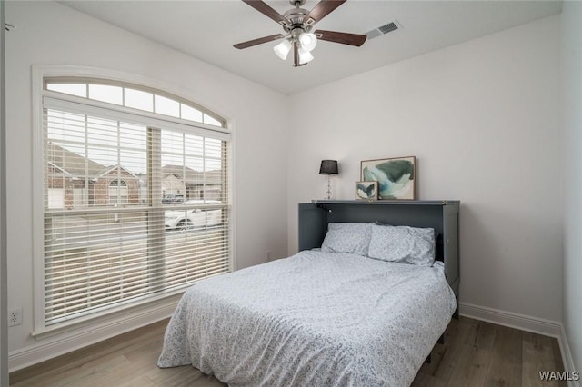 bedroom featuring hardwood / wood-style floors and ceiling fan