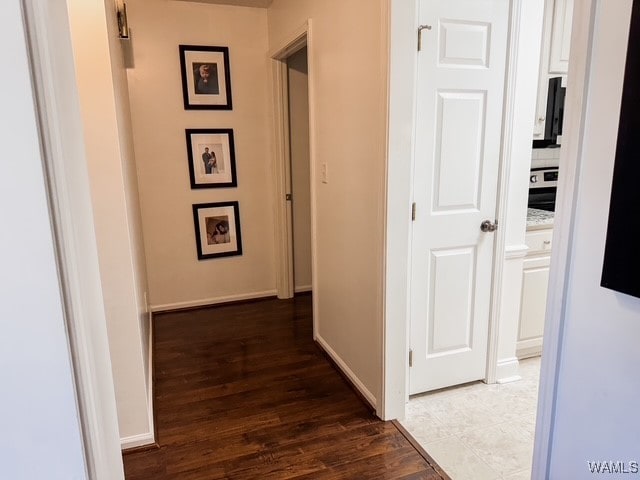 hall with dark hardwood / wood-style floors