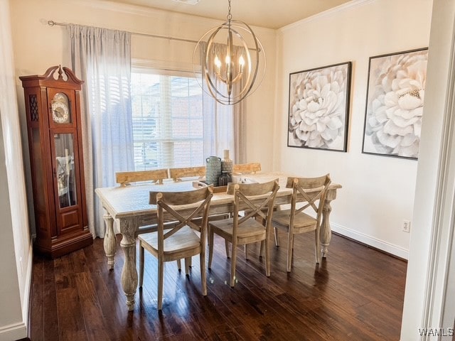 dining area with dark hardwood / wood-style flooring, a chandelier, and ornamental molding