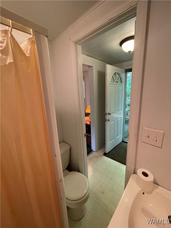 bathroom featuring toilet