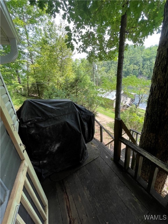 wooden deck with grilling area