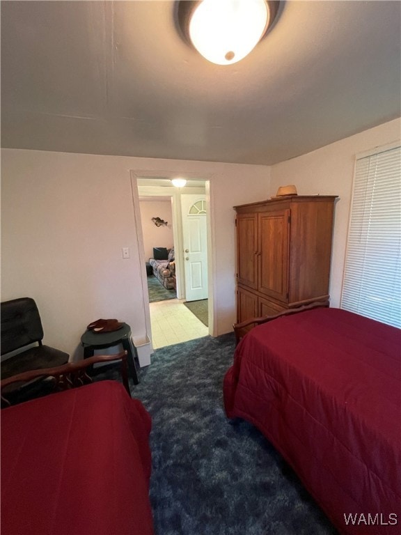 bedroom featuring light colored carpet